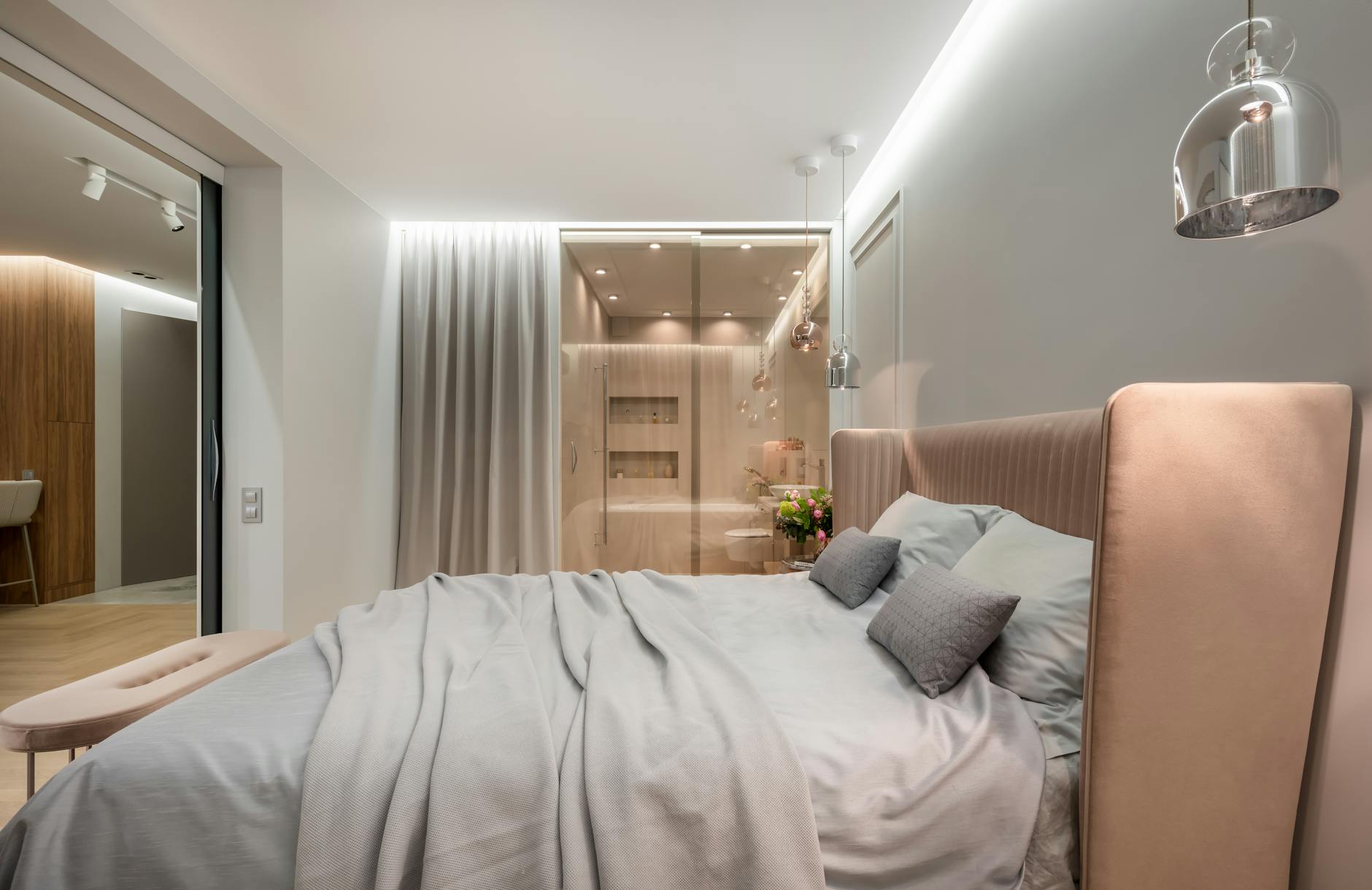 Furnished apartment bedroom — bed bug detection in multifamily housing relies on visual inspection by a trained technician, monitor traps along bed frames and box springs, and (on some properties) third-party canine inspection